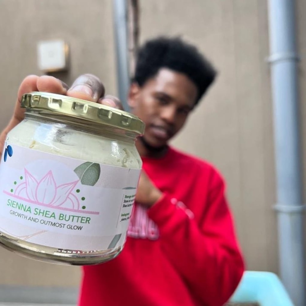 A male customer showing his Sienna Shea Butter